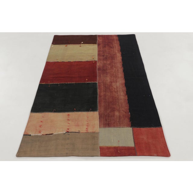 Handwoven in cotton and wool and originating circa 1950-1960, this 4x7 vintage patchwork rug is a bold addition to Rug &...