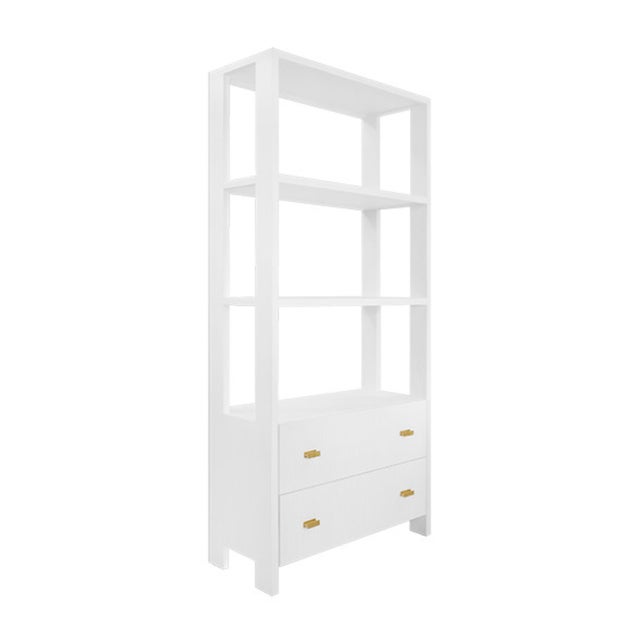 New special order item. Not vintage. The Davie WH matte white etagere is adorned with antique brass hardware. The fluted...