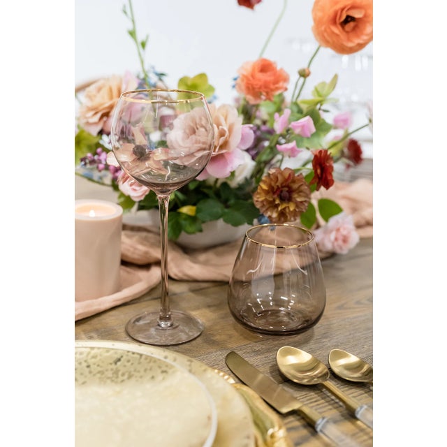 Set of 4 short stemless goblets in Fawn with gold rim. 16 oz, bulbous mouth. Neutral tones provide understated warmth,...