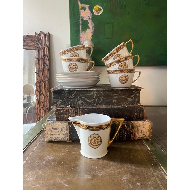 Very pretty French porcelain teacup set, this listing is for 11 pieces. Included are 5 teacups and 5 saucers, and a...