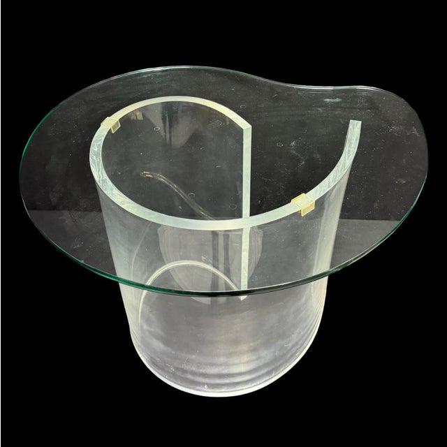 This piece features a lucite base with a glass top. It may or may not have light scuffs to the lucite. Overall, this is...