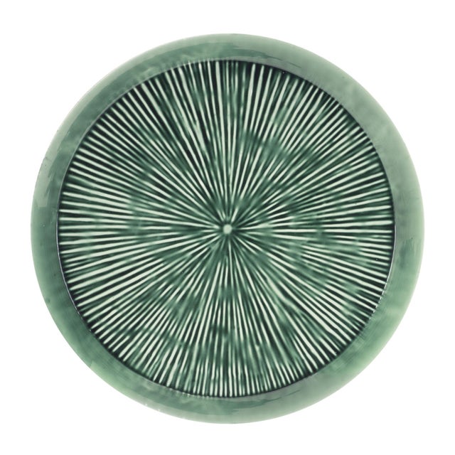 Add a statement piece to your decor with this round etched metal tray. Featuring an earthy green tone with a distressed...