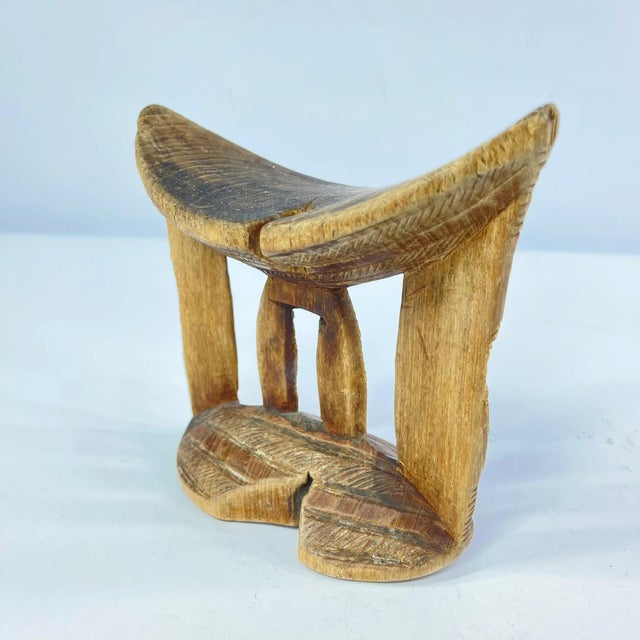 Ethiopian headrests come in various forms. They range from simple to elaborately carved artifacts. They have abstract...