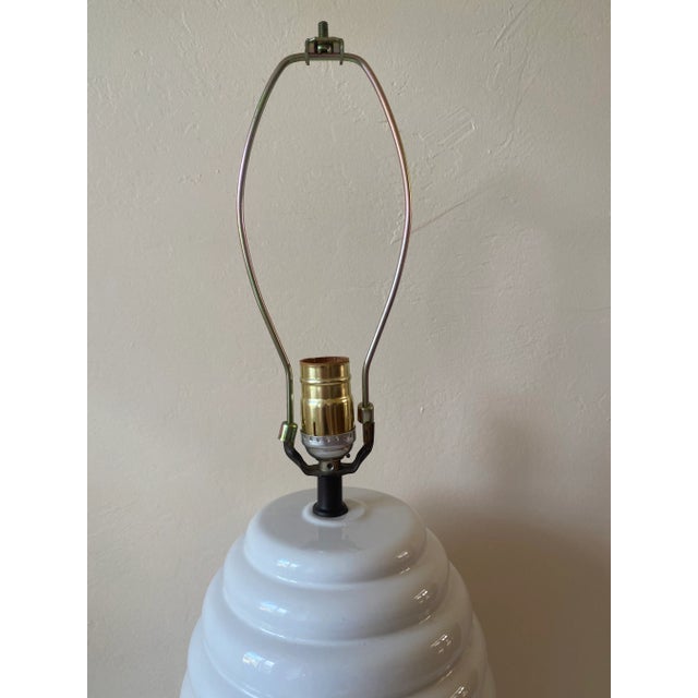 Fabulous Coastal Boho White Ceramic Beehive Style Ribbed Table Lamp. The white color makes this lamp a neutral statement...