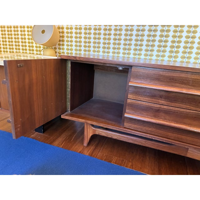 Beautiful mid-century modern walnut concave front credenza produced by Young Manufacturing. in 1970 In pristine condition....