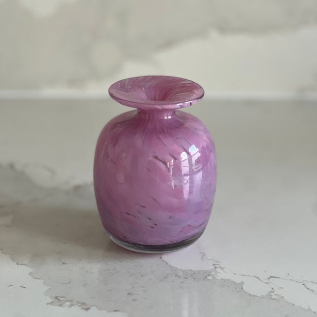 A rare and highly collectable bud vase by Mdina glassware, established in 1968 in Malta by Michael Harris, a lecturer in...