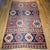 Step into the world of authentic tribal artistry with this exceptional 19th century Caucasian Kazak room size kilim....