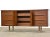 A mid century modern walnut nine drawer dresser with brass accents. Professionally refinished. 66” wide. 18” deep. 31” tall.