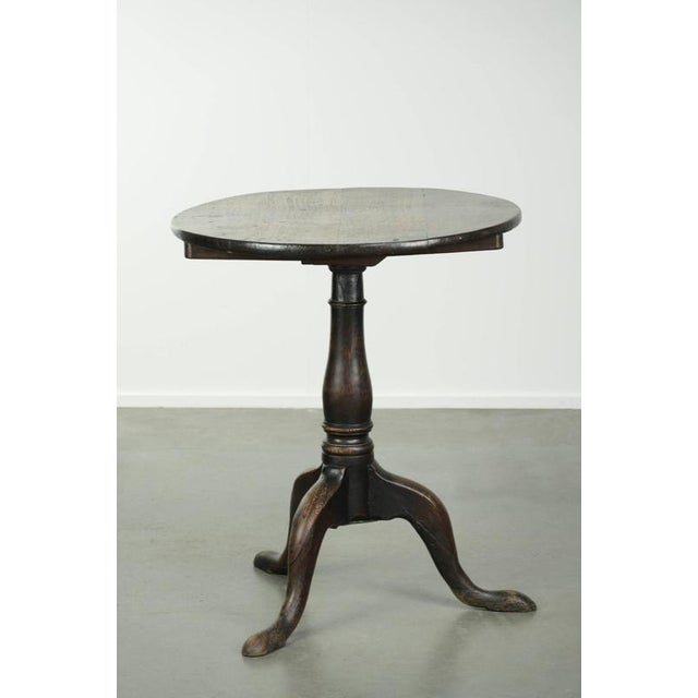This charming 18th-century English oak side table has a stunning appearance and beautiful colors. It was originally a...