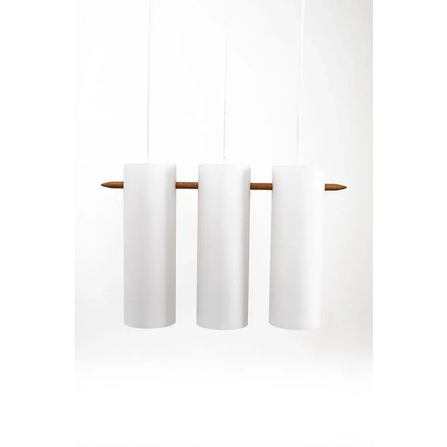 Wonderful luxus hanging lamp designed by uno & östen kristiansson with 3 frosted glass shades and wood. It is in a good...