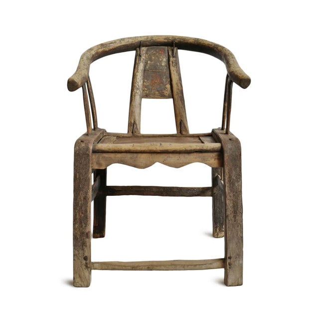 Old northern Chinese elm horseshoe-back armchair, likely dating from the late Qing to early Republic period circa...