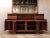 A midcentury Italian buffet cabinet designed by Silvio Coppola for Bernini. This walnut cabinet features two end doors...