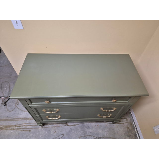 This delightful three-drawer dresser brings a fresh, soothing touch of nature indoors with its soft sage green finish, a...
