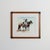 Signed watercolor-style print by Don Weller of two cowboys in hats talking on horseback, one on a red and white paint...