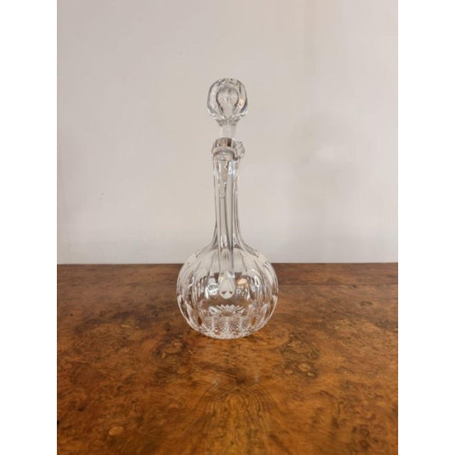 Quality antique Edwardian glass ewer having a quality antique Edwardian cut glass ewer with a shaped handle to the back...