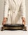 This 19th century pedestal from France is finished in black and gold, worked in wood. Its form follows honest, well-...
