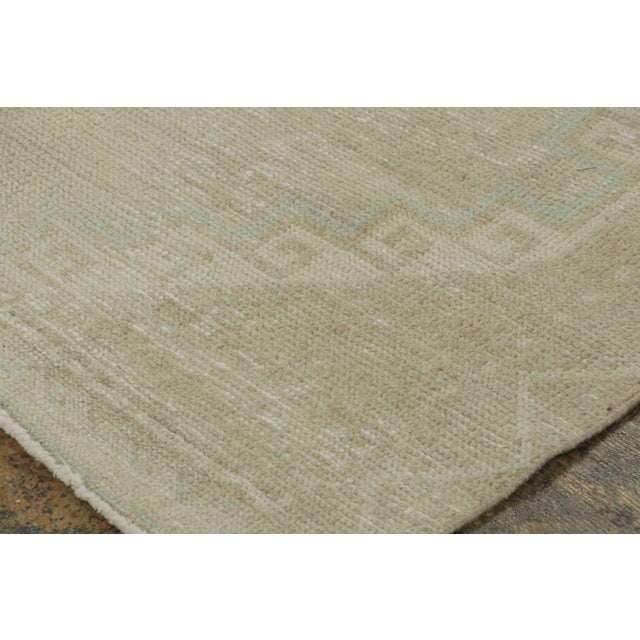 Hand-knotted in wool circa 1950-1959, this 4x8 vintage Turkish runner originating from Turkey is a serene addition to Rug...