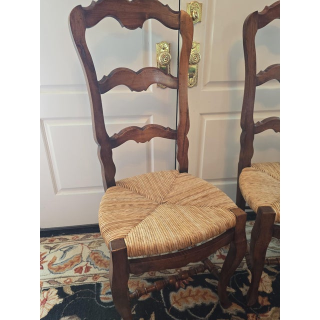 These Vintage French Provincial Chairs are beautifully crafted. Made with a wood frame and featuring a high ladder back...