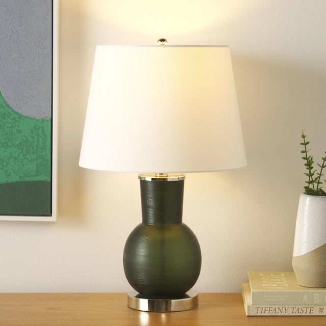 Introducing the Nirav 22 inch dark green glass table lamp, a beautiful addition to your living space. The rich, dark green...
