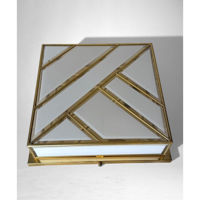 Elegant Italian flush mount ceiling light crafted in brass and opaline glass, distinguished by a sober yet strongly...
