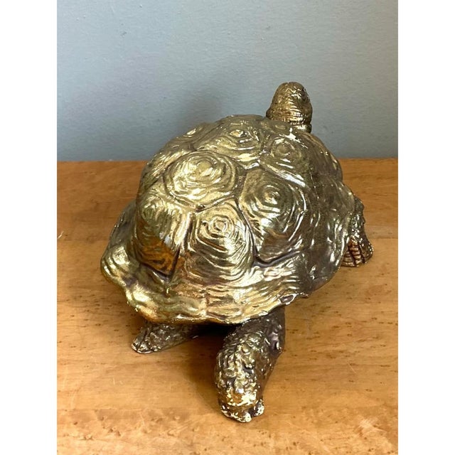 This vintage carved wood turtle figure brings a touch of gilded whimsy to a coffee table, bookshelf, or console. Carved...