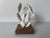 Charming vintage cactus sculpture crafted from painted white metal, mounted on a metal base. This sculptural piece...