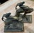 An exceptional pair of authentic, heavy cast iron bookends featuring a highly stylized "Leaping Gazelle" (Ibex) motif,...