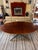 A striking vintage rosewood dining table by Knoll International, featuring a beautifully proportioned oval top supported...