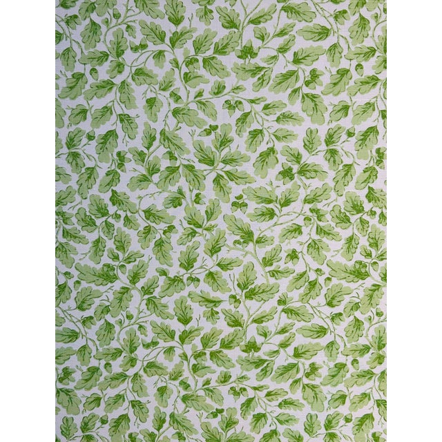 A timeless, small-scale, all-over English pattern of scrolling acorns and leaves. Colored in fresh spring greens on an...