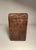 Attributed to the Kuba peoples of the Democratic Republic of the Congo, this unusual small carved wooden container...