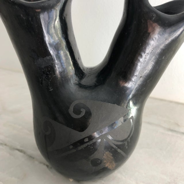 Very lovely polished black wedding vase by Santa Clara Pueblo Pottery. A stunning and highly collectible piece of Native...