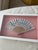 An original Nikki Beach St. Barth fan, artfully preserved in a custom shadow-box presentation. Set against a soft blush...
