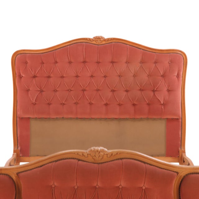 This elegant 1940's bed features a beautifully carved wooden frame with ornate detailing characteristic of its period. The...
