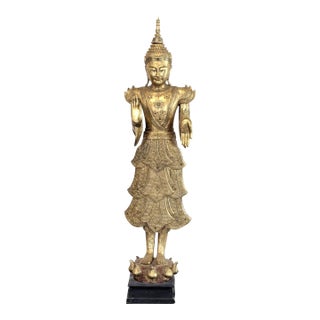 Elegant Carved Gilded Standing Buddha Sculpture With Intricate Details For Sale
