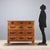 Trentino fir chest of drawers with four drawers fronted by painted floral motifs. Truncated pyramid legs. Fir interior....
