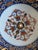 This is a Japanese Imari porcelain bowl with a traditional pattern. Imari ware is a style of Japanese export porcelain...