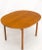 Compact teak Danish Mid-Century Modern dining table w/ large 20" long leaves extensions. Extends up to 78" long.