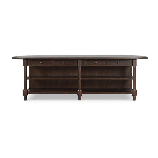 At ten feet long with fully rounded ends, it reads less like furniture and more like a permanent fixture - the kind of...