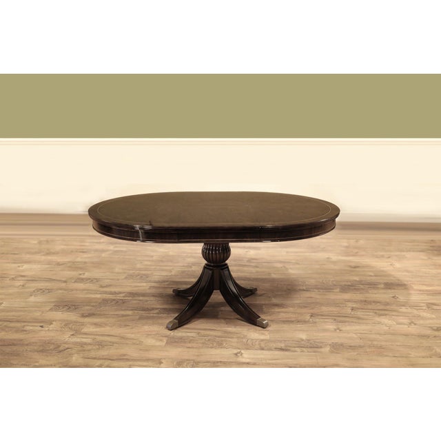 48-inch round-to-oval pedestal table seating 2 to 4 people. The table opens to a 66-inch oval with an 18-inch self-storing...