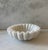 Beautiful white marble stone bowl with an unique "ruffled" edge. Wonderful as a soap dish, catchall for coins, keys or...