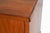 A Danish rosewood sideboard dating to the 1960s, with a long, low profile and a T-base that lends the cabinet a lighter...
