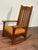 Solid white quarter sawn oak American Arts and Crafts rocking chair. Featuring paddle style arm, shaped top rail support,...