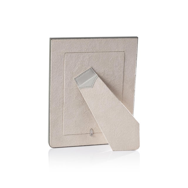 A sophisticated two-tone leather photo frame designed to showcase memories with style. Crafted from genuine Nappa leather,...