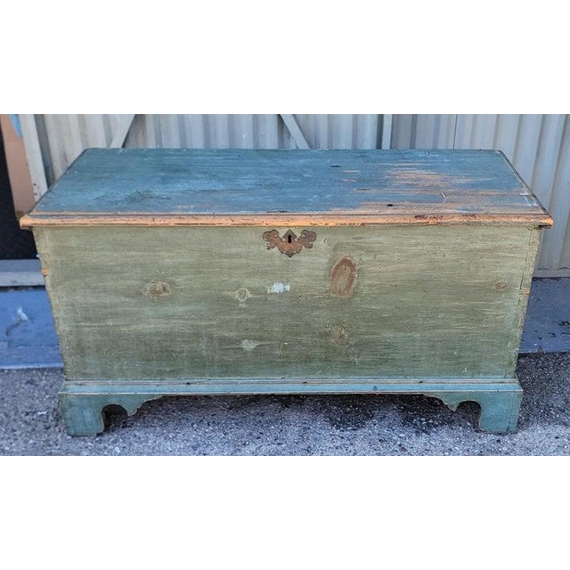 18Thc Original blue painted blanket chest from Pennsylvania with dovetailed construction through out. The brass key plate...