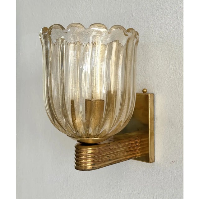 Elegant pair of vintage Italian Murano glass and brass wall sconces, crafted in Venice in the style of Barovier & Toso....