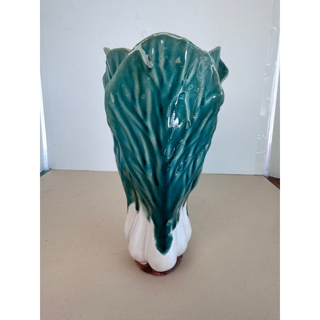 Vintage vase of bok choy. Please note that there are cracks. Only one is visible on the outside. There is also a makers...