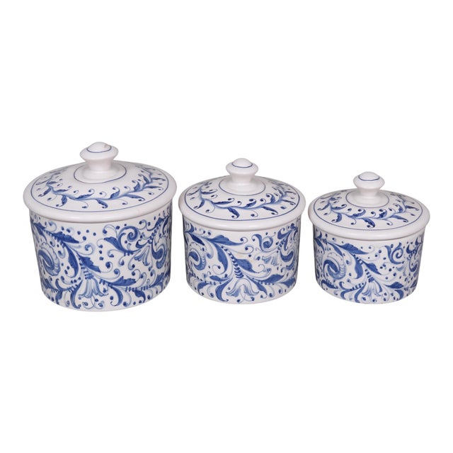 A set of 1960's Italian export ceramic cannisters made by Mancioli. Each cannister is hand painted in cobalt blue over...