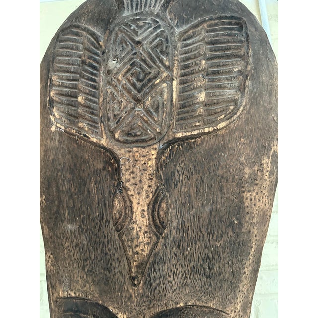 Vintage Large Hand-Carved Tribal Head Sculpture Hand-carved tribal head sculpture featuring an elongated face with finely...