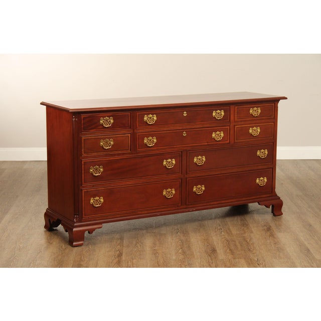 High Quality American Made Inlaid Mahogany Chest with Dovetailed Drawers, Brass Hardware, and Reeded Columnar Accents.