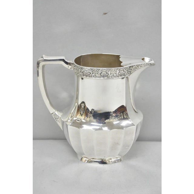 Vintage Oneida "Coronation" Community Silver Plated Art Deco Faceted Ice Lip Water Pitcher with Handle. Circa Mid 20th...